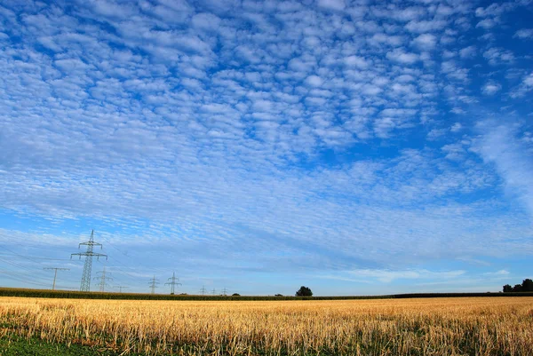 Clouds over rural landscape — Stock Photo, Image