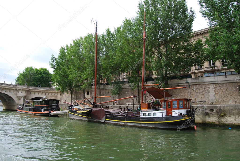 Private yacht and ship at Seine bank