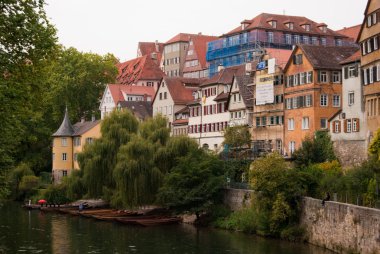 Neckar river with boats and Tübingen clipart