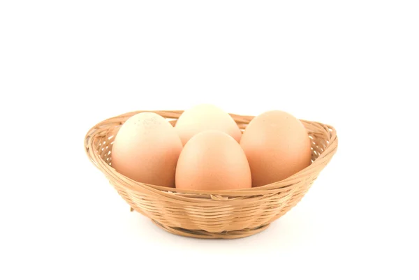 Eggs in a wicker basket — Stock Photo, Image