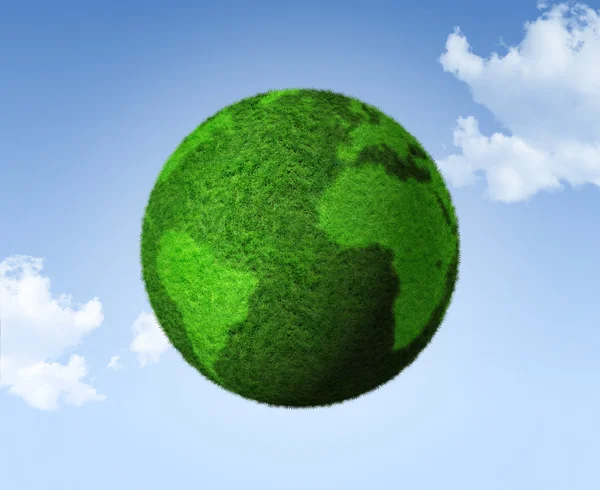 3D green grass globe on a blue sky — Stock Photo, Image