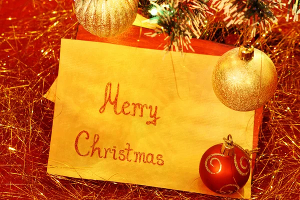 Biglietto di auguri e ornamenti natalizi — Foto Stock