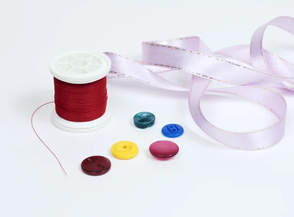Threads with buttons and tape — Stock Photo, Image