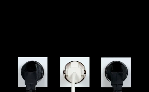 Wall outlets on a black background — Stock Photo, Image