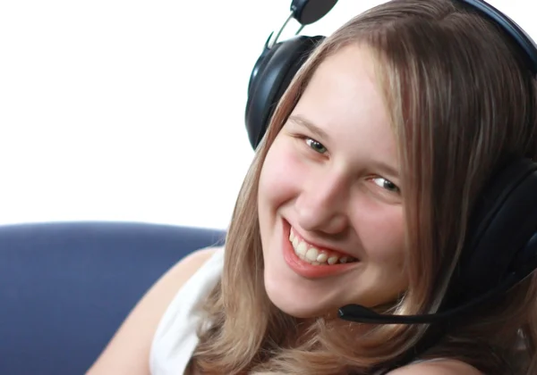 Joven mujer sonriente en auriculares —  Fotos de Stock