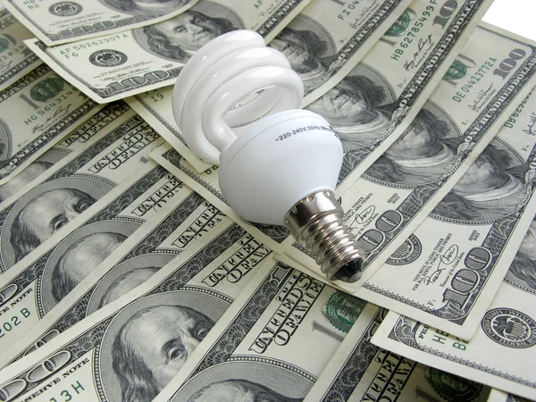 Lamp on dollars — Stock Photo, Image