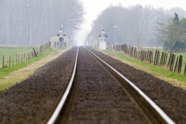 Railtrack with hazy crossing. clipart