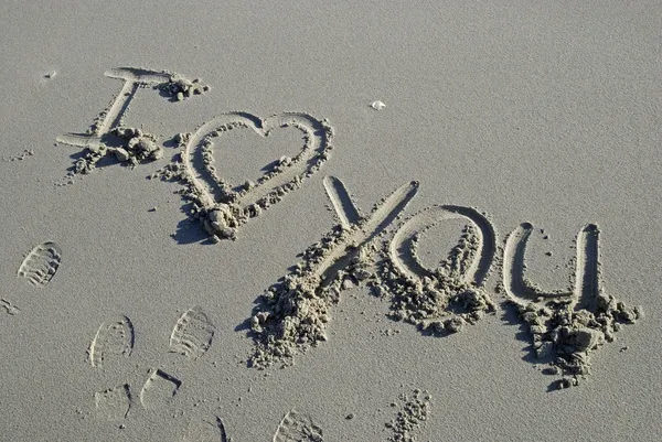 stock image I love you inscription in sand