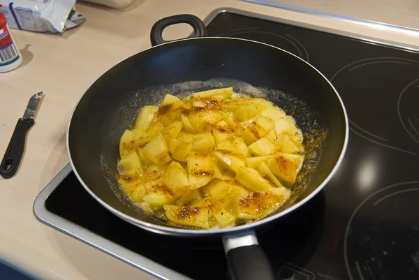 Potatoes roasted in frying pan.