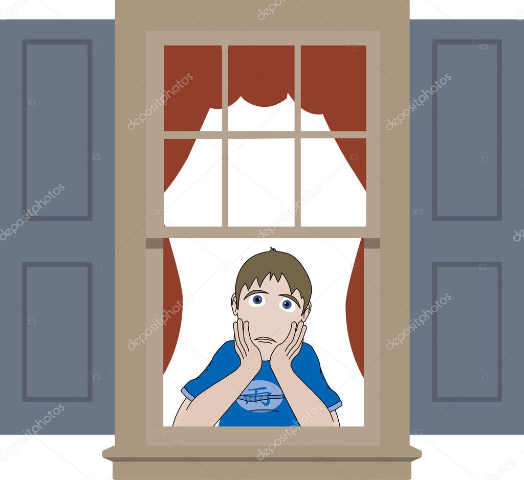 Sad boy leaning in window sill