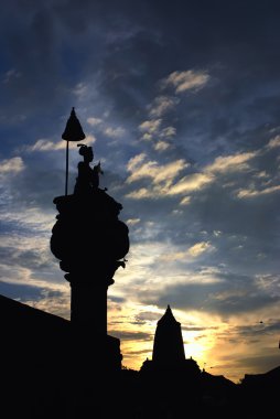 Ancient sculpture under beautiful sunset