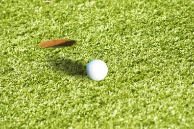 Closeup of a ball on a golf course