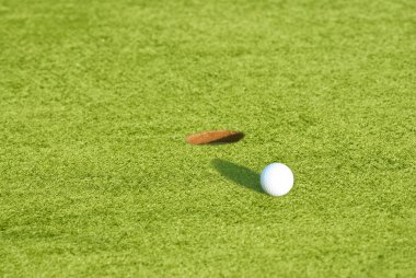 Closeup of a ball on a golf course