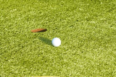 Closeup of a ball on a golf course