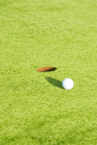 Closeup of a ball on a golf course — Stok fotoğraf