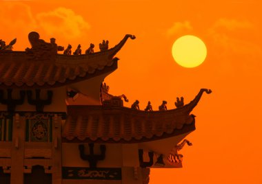 Chinese dragon roof with sunset clipart