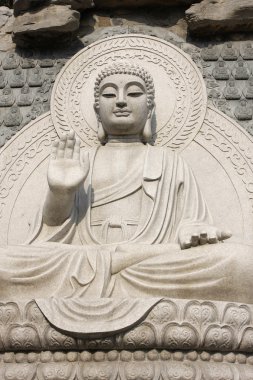 Stone Buddha Statue at temple in jinan, clipart