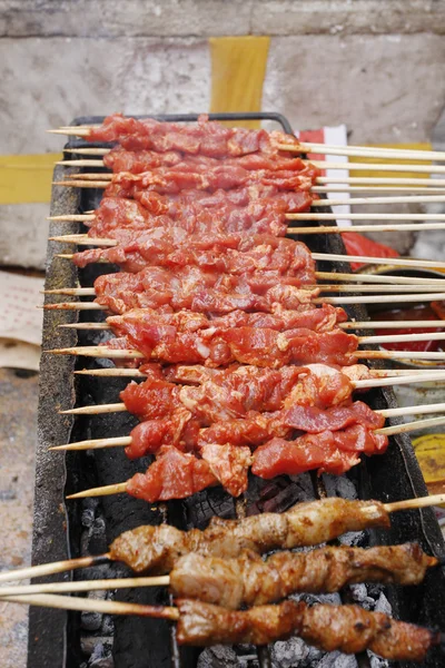 stock image Closeup of shish kebab that is being gri