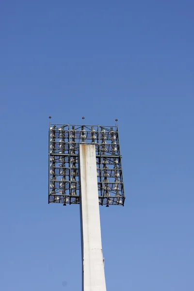 Stadium lights against a blue sky — Stock Photo, Image