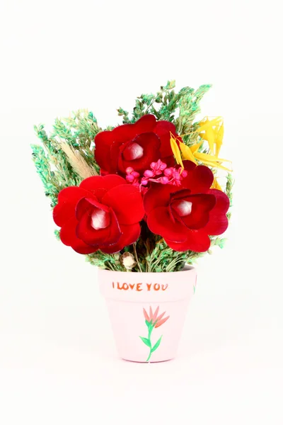 Red flowers in a pot with text — Stock Photo, Image