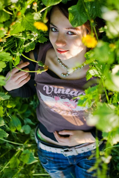 Girl in dandelions — Stock Photo, Image
