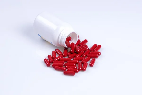 No frasco do medicamento derrama pílula — Fotografia de Stock