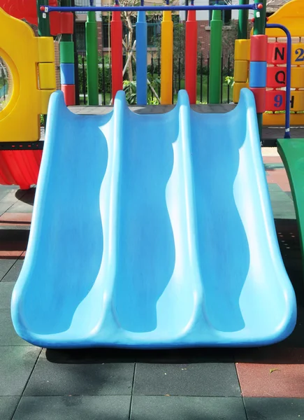 Stock image The colorful plastic slide in a kindergarten.