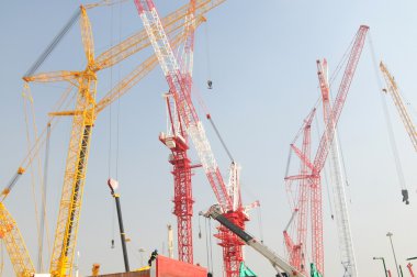 The busy construction site with many high cranes,shanghai,Chi na. clipart