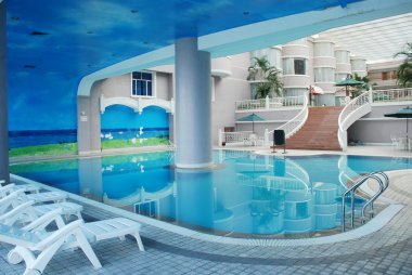 The indoor hotel swimming pool clipart