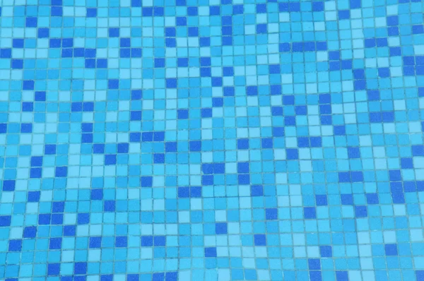 The blue clear water ripples and mosaic swimming pool ground seamless background. — Stock Photo, Image