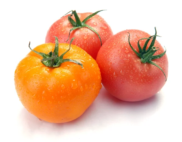 Three tomatoes with drops — Stock Photo, Image