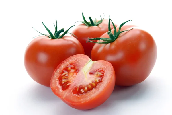 Czerwone pomidory i pół — Zdjęcie stockowe