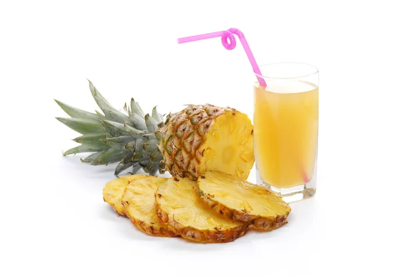 Pineapple with slices and juice — Stock Photo, Image