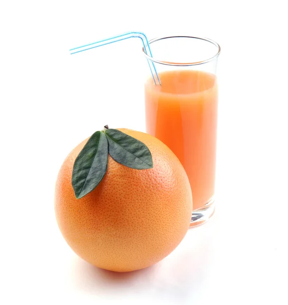 Grapefruit and juice glass — Stock Photo, Image