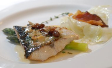 Sea bass with an asparagus and raisin clipart