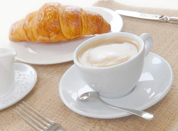 Cup of coffee with croissant — Stock Photo, Image