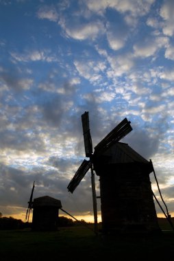 Windmills against the sunset sky clipart