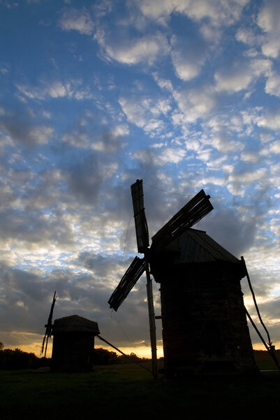 Windmills against the sunset sky
