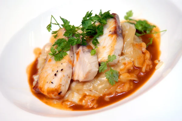 Rizotto with a fried pike perch in sauce — Stock Photo, Image