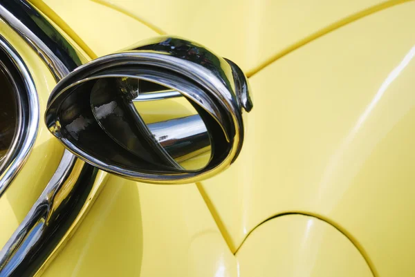 Rearview mirror on yellow car — Stock Photo, Image
