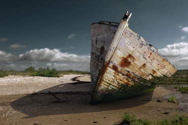 White rusty prow on the beach clipart