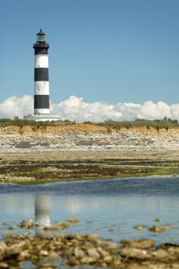 Lighthouse at low tide clipart