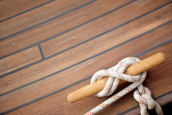 stock image Sailing knot on a wooden floor