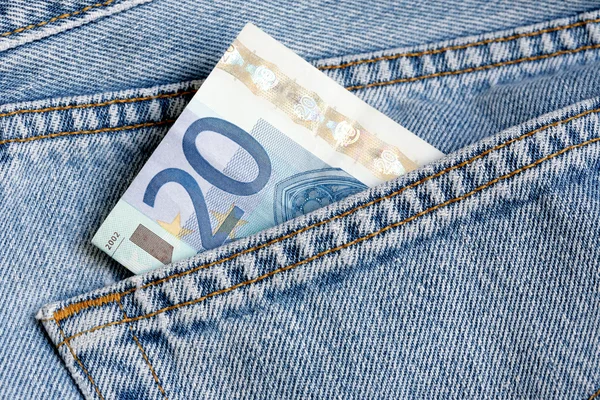 Dinheiro no bolso azul jeans — Fotografia de Stock