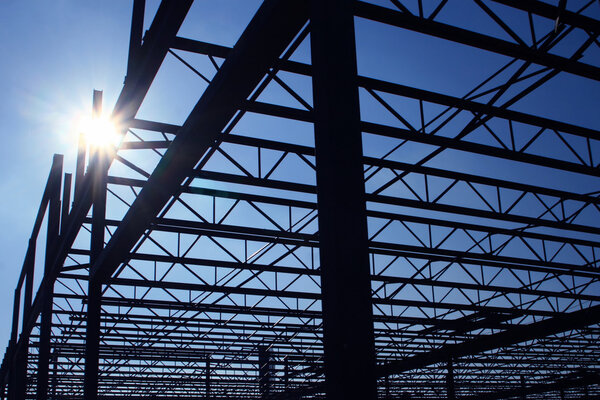 Silhouette of a steel frame building under construction