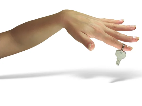 Strony kobieta podając klucz na białym tle — Zdjęcie stockowe