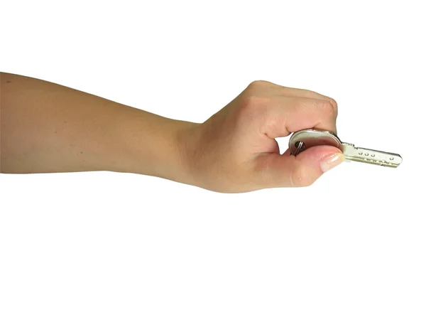 Kvinna hand ger nyckeln isolerade — Stockfoto