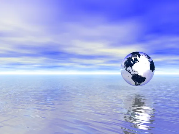 Абстрактный стеклянный шар над голубым океаном — стоковое фото