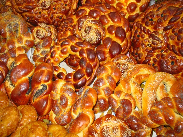 Big assortment of sweet baked bread — Stock Photo, Image