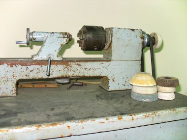 Ancient old rusty turning lathe clipart